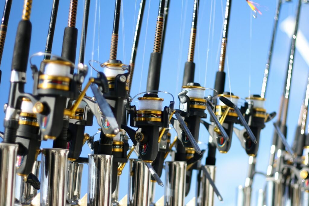 Spinning reels spooled with different fishing line types on a rod rack